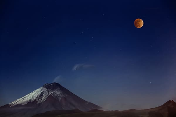 Image Name: Cotopaxi and Red Moon Copyright: © Victor Vargas, Ecuador, 1st, Place, National Award, 2016 Sony World Photography Awards