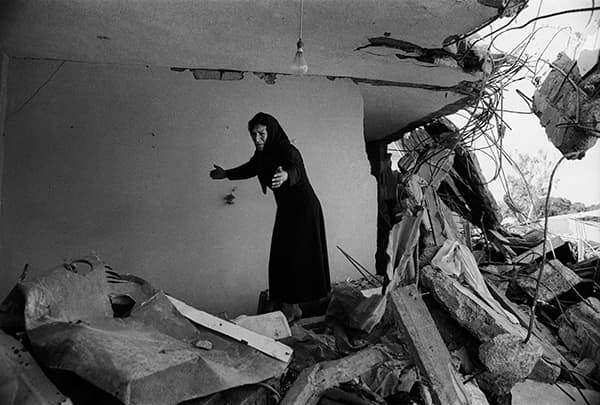 Photo London 2016 A Palestinian Woman Returning to the Ruins of her House, Sabra, Beirut, 1982 © Don McCullin, courtesy Hamiltons Gallery, London
