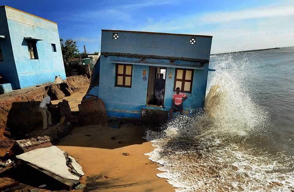 Double Disaster: Houses of tsunami survivors being washed away in sea erosion in Ennore near Nettukuppam in Chennai. pic by S L Shanth Kumar