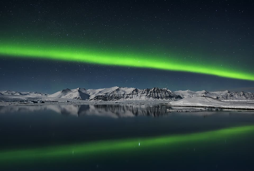 The northern lights illuminate the lagoon at Jokulsarlon, Iceland photo tour, February 2016