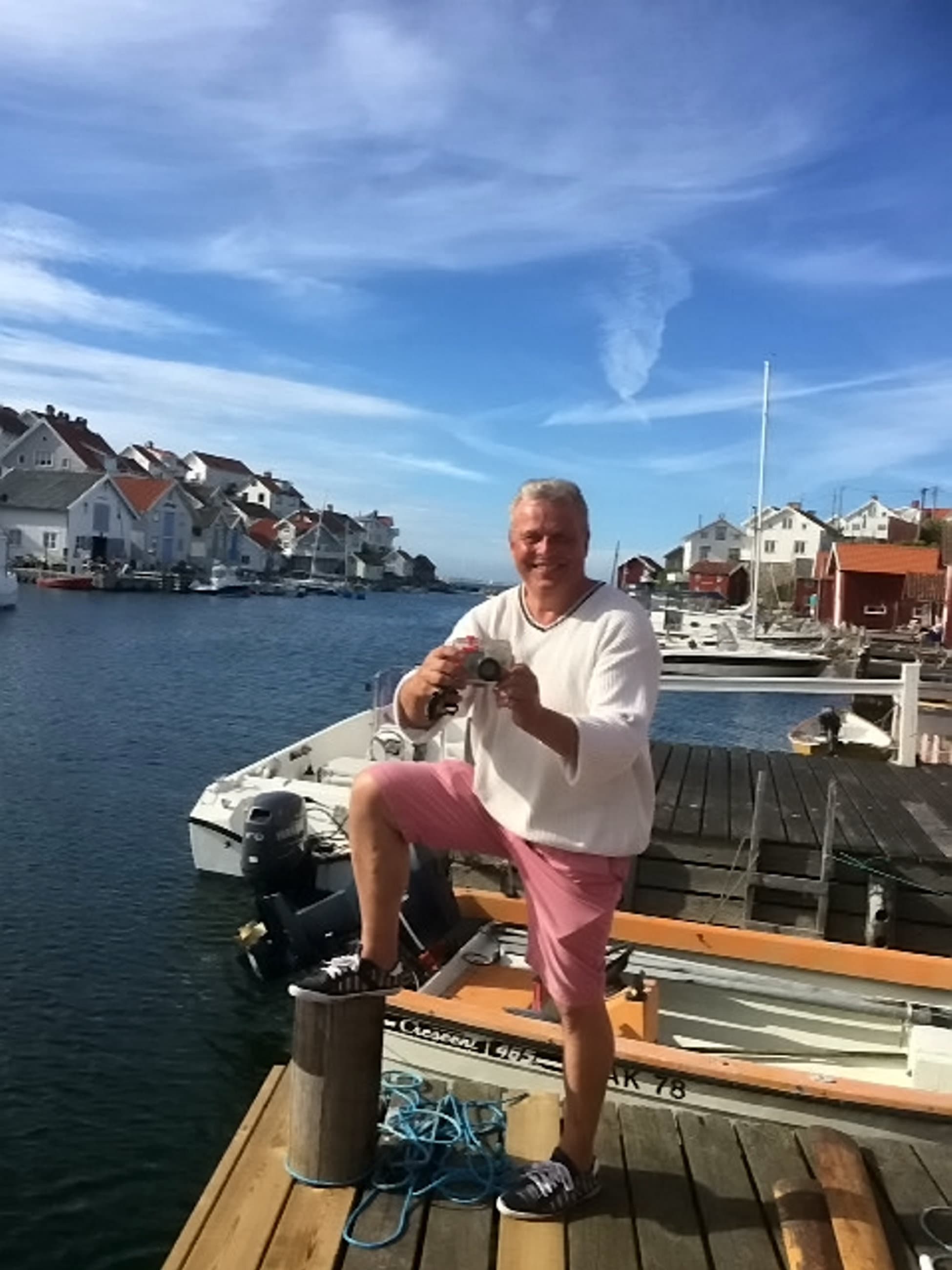 Lars Mossberg pictured on the small Swedish island where he lives holding Adele Devonshire's camera. Source: SWNS