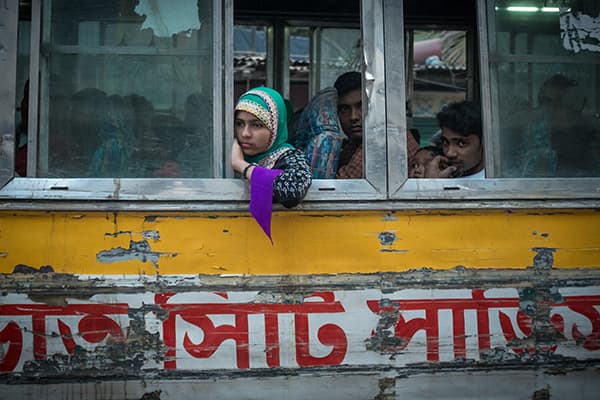 A girl caught in deep thought on a bus in Dhaka, Bangladesh
