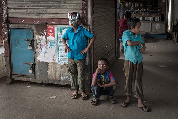 Boys hang out in a train station near Sylhet, Bangladesh