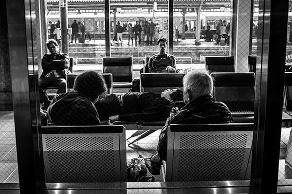 Passengers rest in a waiting room at Kyoto train station