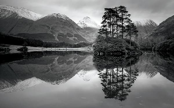 Given its sheltered location, Lochan Urr can often be calm enough to reflect the backdrop