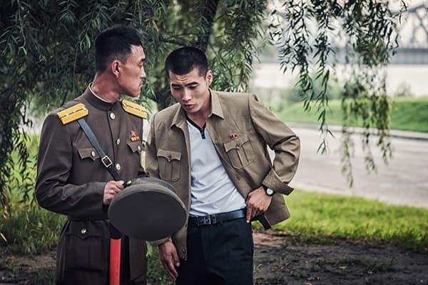 Two North Korean soldiers deep in conversation
