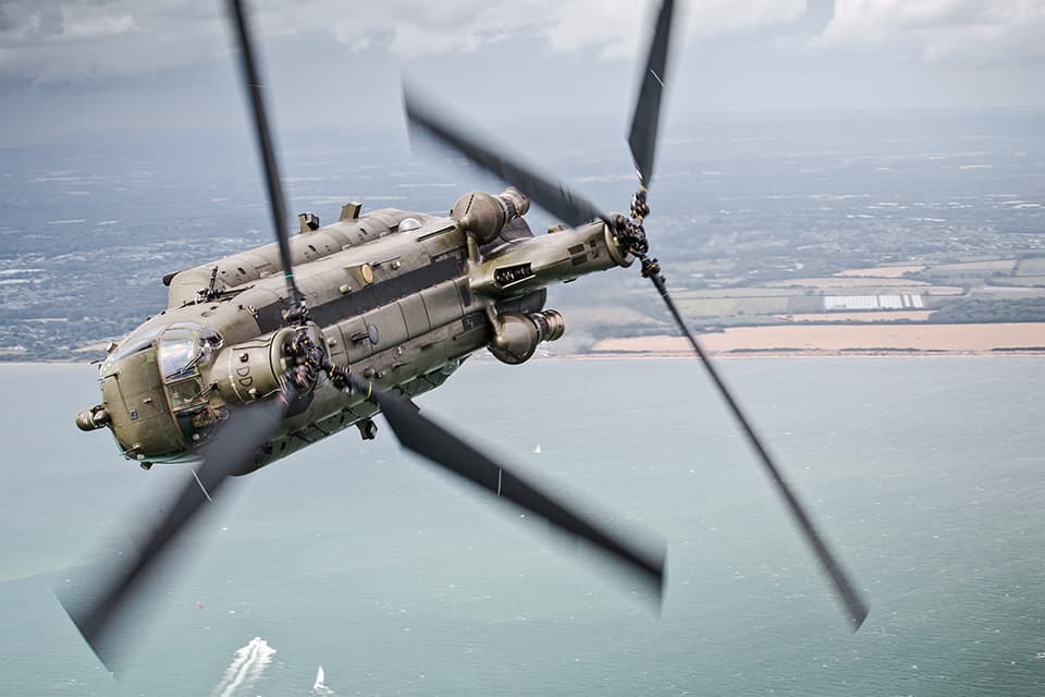 2015-07-22. The Solent, Southern England, United Kingdom. Pictured: A 27 Sqn Chinook makes a hard bank over The Solent during a Aircraft Handling Exercise to assess the development of new Pilots and Aircrew. As part of a 2-day Training Exercise, 27 Sqn, based out of RAF Odiham flew several sorties over Southern England and the Channel to assess the handling standards and flying abilities of their Aircrew and Pilots. Operating the Mk4 Chinook, the crews participated in several scenarios, including confined spaces landing, flying over the sea, low level flight and underslung loads. These sorties incorporated formation flying, which enabled Service air-to-air photography and experience flights for station personnel. SAC Nicholas Egan is an RAF Photographer currently based out of RAF Odiham, Hampshire. He joined the Royal Air Force in 2011, and following his time at the Defence School Of Photography at Cosford, was posted to Aldergrove Flying Station in Northern Ireland. Following his two years spent in Northern Ireland, he was posted to RAF Odiham in January 2015. Photographers details: SAC Nicholas Egan. Photographic Section | RAF Odiham | Hook | Hampshire | RG29 1QT 01256 367289 |