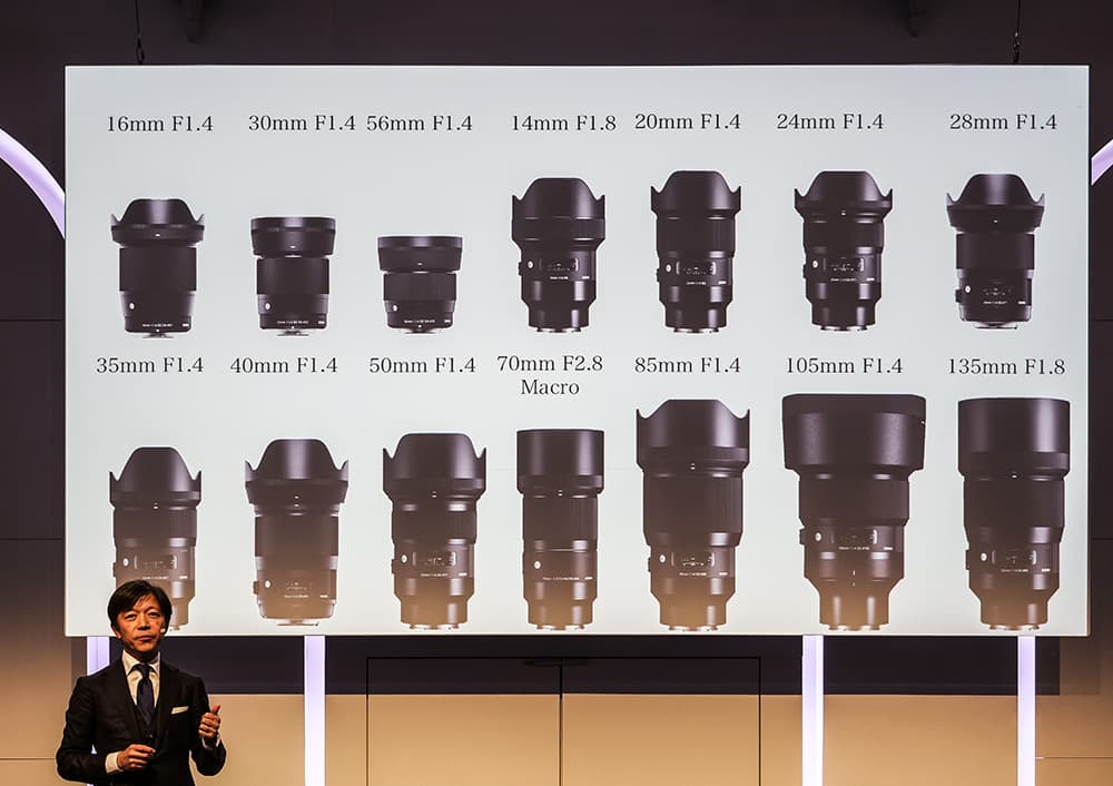 Sigma CEO Kazuto Yamaki announcing the 14 lenses that will be launched in the L mount in 2019
